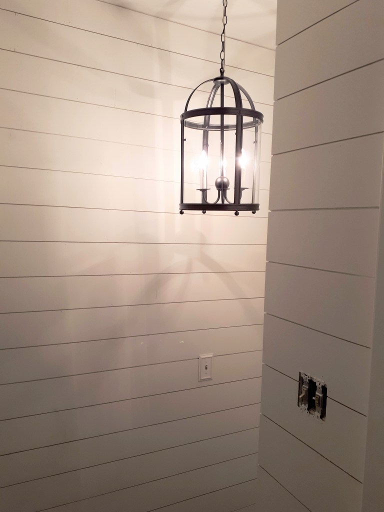 This image has an empty alt attribute; its file name is diy-faux-shiplap-stairwell-with-lantern-light.jpg
